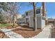 Landscaped backyard features a patio area, mature trees, and a well-maintained lawn at 5275 Holmes Pl, Boulder, CO 80303