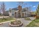 Two-story home with manicured lawn, mature trees, and a welcoming front porch at 5275 Holmes Pl, Boulder, CO 80303