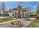 Inviting home exterior with a well-manicured yard, brick accents, and lush landscaping at 5275 Holmes Pl, Boulder, CO 80303