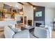 Spacious living room with a fireplace, high ceilings, a balcony and hardwood floors at 5275 Holmes Pl, Boulder, CO 80303