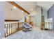 Loft space with vaulted ceilings, wooden railing, and natural light at 5275 Holmes Pl, Boulder, CO 80303