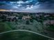 Scenic aerial view of a neighborhood featuring lush greenery, golf course, and stunning homes at 4822 Bandera Pl, Parker, CO 80134
