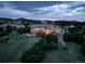 Aerial dusk view of a stunning home with lush greenery and neighborhood at 4822 Bandera Pl, Parker, CO 80134