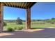 Back patio featuring stone columns, with a serene outdoor view at 4822 Bandera Pl, Parker, CO 80134