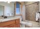 Charming bathroom featuring tilework, granite countertop, and bathtub-shower with linen closet at 4822 Bandera Pl, Parker, CO 80134