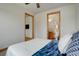 Bedroom view featuring an ensuite bathroom and additional room, offering convenience and privacy at 4822 Bandera Pl, Parker, CO 80134