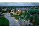 Stunning exterior view of the estate home with lush landscaping, a circular driveway, and a beautiful horizon view at 4822 Bandera Pl, Parker, CO 80134