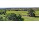 Scenic golf course view showcasing lush green fairways and upscale homes in a well-manicured community at 4822 Bandera Pl, Parker, CO 80134