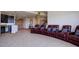 Home theater with leather recliners, wet bar, and staircase, perfect for entertaining and relaxation at 4822 Bandera Pl, Parker, CO 80134