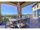 Covered outdoor dining area offering shade and a scenic view at 4822 Bandera Pl, Parker, CO 80134