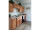 Functional kitchen with wood cabinets, laminate countertops, and appliances at 5640 E 67Th Pl, Commerce City, CO 80022