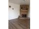 Inviting living room featuring a brick fireplace and neutral paint at 5640 E 67Th Pl, Commerce City, CO 80022