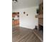 Open-concept living area with a brick fireplace and view into the kitchen at 5640 E 67Th Pl, Commerce City, CO 80022