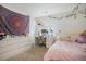 Cozy bedroom featuring a stylish vanity area and a comfortable bed with pink bedding at 8975 S Coyote St, Highlands Ranch, CO 80126