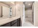 Clean bathroom with a single sink vanity and combined tub/shower, providing a functional and tidy space at 785 Iris St, Brighton, CO 80601