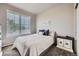 Comfortable bedroom with a large window providing ample natural light at 785 Iris St, Brighton, CO 80601