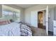 Bedroom featuring plush carpet, natural light, and a bathroom at 785 Iris St, Brighton, CO 80601