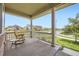Relaxing front porch with comfortable seating and scenic neighborhood views at 785 Iris St, Brighton, CO 80601