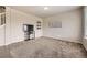 Bright living room with carpet and neutral paint at 785 Iris St, Brighton, CO 80601