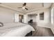Spacious bedroom features a ceiling fan, wood floors, and an attached sitting area for added relaxation and comfort at 785 Iris St, Brighton, CO 80601