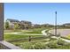 Picturesque neighborhood with well-maintained green spaces, sidewalks, and attractive residential architecture at 785 Iris St, Brighton, CO 80601