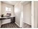 Compact office space with built in desk and storage with hardwood floors, perfect for working from home at 785 Iris St, Brighton, CO 80601