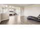 Relaxing sitting area with wood floors, offers a cozy space adjacent to the main bedroom for relaxation at 785 Iris St, Brighton, CO 80601