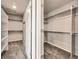 A generously sized walk-in closet features custom shelving and ample storage space at 785 Iris St, Brighton, CO 80601