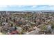 Expansive aerial view showcasing the community, surrounding greenery, and city skyline at 1582 Fairfax St, Denver, CO 80220
