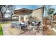 Backyard outdoor patio with outdoor furniture, mature landscaping at 1582 Fairfax St, Denver, CO 80220