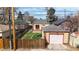 Aerial view of fenced backyard with a garage and a patio at 1582 Fairfax St, Denver, CO 80220