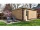 Detached garage, patio, and outdoor lounge chairs in the backyard at 1582 Fairfax St, Denver, CO 80220