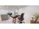 Bright basement home office space with a stylish desk and seating area at 1582 Fairfax St, Denver, CO 80220