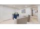 Basement living area offers cozy seating with stylish chairs and a cabinet with TV at 1582 Fairfax St, Denver, CO 80220