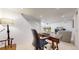 Finished basement featuring a home office space with a desk and a comfortable seating area at 1582 Fairfax St, Denver, CO 80220