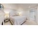 Cozy bedroom with soft lighting, a comfortable bed, and a view into an adjoining space at 1582 Fairfax St, Denver, CO 80220