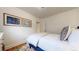 Bright bedroom with hardwood floors and art, featuring a comfortable bed and closet at 1582 Fairfax St, Denver, CO 80220