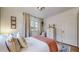 Inviting bedroom with bed, large windows, dresser, closet and modern ceiling light at 1582 Fairfax St, Denver, CO 80220