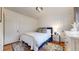 Bright bedroom featuring a comfortable bed, large window and a stylish dresser at 1582 Fairfax St, Denver, CO 80220