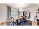 Elegant dining room with table, chairs, and natural light creating a warm atmosphere at 1582 Fairfax St, Denver, CO 80220