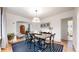 Cozy dining room with table, chairs, and view into the living room at 1582 Fairfax St, Denver, CO 80220