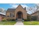 Charming brick home with arched entry, lovely landscaping, and a classic, inviting facade at 1582 Fairfax St, Denver, CO 80220