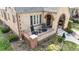 Inviting front porch with brick railing and comfortable chairs for enjoying the outdoors at 1582 Fairfax St, Denver, CO 80220