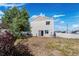 Spacious backyard with white fence and stone landscaping at 4528 Andes St, Denver, CO 80249