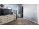 Bedroom featuring a window, dresser, tv, and fan at 4528 Andes St, Denver, CO 80249