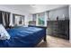 Serene bedroom featuring stylish furniture, a comfortable bed, and soft lighting, creating a tranquil retreat at 4528 Andes St, Denver, CO 80249