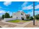 Corner lot home featuring a spacious yard, white fencing, and a manicured lawn, perfect for outdoor activities and privacy at 4528 Andes St, Denver, CO 80249