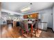 Well-designed kitchen with adjacent dining area, stainless steel refrigerator, and convenient access to the living room at 4528 Andes St, Denver, CO 80249