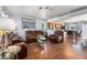 Inviting open-concept living room flowing into the kitchen and dining area, featuring hardwood floors and comfortable seating at 4528 Andes St, Denver, CO 80249