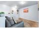 Cozy loft area featuring neutral decor, plush carpeting, and ample natural light, perfect as a relaxation or entertainment space at 4528 Andes St, Denver, CO 80249